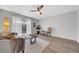 Living room featuring hardwood floors, neutral decor, and a view of the outdoor balcony at 1142 84Th N Ter # C, St Petersburg, FL 33702