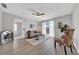 Inviting living room with hardwood floors, neutral decor, and sliding glass doors to the balcony at 1142 84Th N Ter # C, St Petersburg, FL 33702