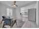 Inviting living room leading to the kitchen, featuring tiled floors and comfortable seating at 1142 84Th N Ter # C, St Petersburg, FL 33702
