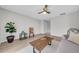Open living room featuring hardwood floors, a ceiling fan, and plenty of natural light at 1142 84Th N Ter # C, St Petersburg, FL 33702