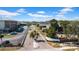 Community street view showing neighborhood entrance, mature trees, and well-maintained landscaping at 1142 84Th N Ter # C, St Petersburg, FL 33702