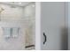 Elegant bathroom featuring a walk-in shower with marble tiling and rainfall showerhead at 1213 Bay Club Cir, Tampa, FL 33607