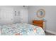 Cozy bedroom with stylish decor, starfish themed bedding, and a view of the closet and hallway at 1213 Bay Club Cir, Tampa, FL 33607