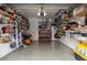 Spacious garage featuring ample storage shelves, well lit interior and epoxy flooring at 1213 Bay Club Cir, Tampa, FL 33607