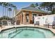 Community hot tub with chairs and tropical landscaping at 1213 Bay Club Cir, Tampa, FL 33607