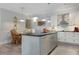 Stylish kitchen featuring a center island, pendant lighting, and stainless steel appliances at 1213 Bay Club Cir, Tampa, FL 33607