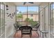 Enjoy outdoor dining on this screened lanai with comfortable wicker seating at 1213 Bay Club Cir, Tampa, FL 33607