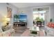 Inviting living room extends to a screened lanai offering tropical outdoor views at 1213 Bay Club Cir, Tampa, FL 33607