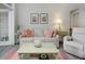 Comfortable living room features a neutral sofa with decorative starfish pillows at 1213 Bay Club Cir, Tampa, FL 33607