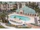 Beautiful community pool with plenty of lounge seating and ocean views surrounded by elegant condos at 1213 Bay Club Cir, Tampa, FL 33607