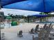 A modern aquatic center featuring a kiddie splashpad, lap pool, and lounge area at 1421 Monte Carlo Dr, Clearwater, FL 33764