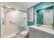 Updated bathroom featuring tiled shower with glass doors, modern vanity, and ample lighting at 1421 Monte Carlo Dr, Clearwater, FL 33764