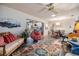 Open concept living room with a decorative rug, fireplace, and view into the dining room at 1421 Monte Carlo Dr, Clearwater, FL 33764