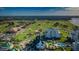 Beautiful aerial view of a golf course and resort community with stunning landscaping and water features at 150 Belleview Blvd # 307, Belleair, FL 33756