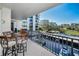 Relax on this condo's balcony with views of the building, parking lot, and pool at 150 Belleview Blvd # 307, Belleair, FL 33756