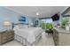 Serene bedroom with a plush bed, scenic views, and neutral decor at 150 Belleview Blvd # 307, Belleair, FL 33756