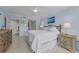 Calm bedroom with a wrought iron bed, dresser, and scenic decor at 150 Belleview Blvd # 307, Belleair, FL 33756