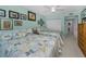 This bedroom features two beds, light teal walls, and white tile floors at 150 Belleview Blvd # 307, Belleair, FL 33756