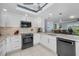 Modern kitchen featuring stainless steel appliances and lots of counter space at 150 Belleview Blvd # 307, Belleair, FL 33756
