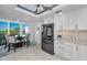 Bright kitchen with a breakfast nook, modern appliances, and views at 150 Belleview Blvd # 307, Belleair, FL 33756