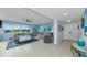 Bright living room featuring tile floors, comfortable seating, and large windows with outdoor views at 150 Belleview Blvd # 307, Belleair, FL 33756