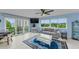 Comfortable living room with large windows offering beautiful views of the water at 150 Belleview Blvd # 307, Belleair, FL 33756