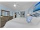 Serene bedroom with plush bedding, a dresser, and a calming color scheme at 150 Belleview Blvd # 307, Belleair, FL 33756