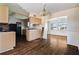 A kitchen and dining room with wood floors and an open plan at 1517 Danbury Dr, Sun City Center, FL 33573