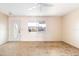 Cozy living room featuring neutral walls, carpeted floors, a ceiling fan, and natural light at 1517 Danbury Dr, Sun City Center, FL 33573