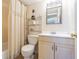This bathroom has a toilet, single sink vanity, and shower-tub combo at 1750 Belleair Forest Dr # A7, Belleair, FL 33756