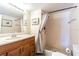 Bathroom featuring marble vanity top and walk in shower at 1750 Belleair Forest Dr # A7, Belleair, FL 33756