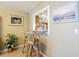 Breakfast bar with seating and view into kitchen at 1750 Belleair Forest Dr # A7, Belleair, FL 33756
