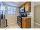 Kitchen featuring stainless steel appliances and wood cabinetry at 1750 Belleair Forest Dr # A7, Belleair, FL 33756