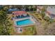 Community pool with lounge chairs, perfect for relaxation and enjoying the Florida sunshine at 1750 Belleair Forest Dr # A7, Belleair, FL 33756