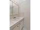 Small bathroom featuring a sink, vanity, tiled countertop, and white walls at 18675 Us Highway 19 N # 251, Clearwater, FL 33764