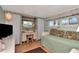 Bright bedroom with a daybed, desk, and large windows with views at 18675 Us Highway 19 N # 251, Clearwater, FL 33764
