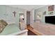 Spare bedroom with TV, side table, and light-green walls at 18675 Us Highway 19 N # 251, Clearwater, FL 33764