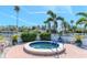 Relaxing hot tub area surrounded by lush landscaping and a serene atmosphere at 18675 Us Highway 19 N # 251, Clearwater, FL 33764