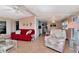 Cozy living room featuring comfortable seating, stylish decor, and ample natural light at 18675 Us Highway 19 N # 251, Clearwater, FL 33764