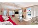 Bright and airy living room featuring sliding glass doors to the outside and comfortable furnishings at 18675 Us Highway 19 N # 251, Clearwater, FL 33764