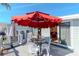 Deck patio area with a red umbrella at 18675 Us Highway 19 N # 251, Clearwater, FL 33764