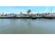 Waterfront view of a community with docks and palm trees at 18675 Us Highway 19 N # 251, Clearwater, FL 33764