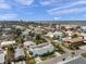 Coastal community aerial view with the turquoise home near beaches and local amenities at 2011 1St St, Indian Rocks Beach, FL 33785