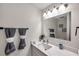 Bathroom featuring a vanity sink, mirror and towel rack at 2011 1St St, Indian Rocks Beach, FL 33785