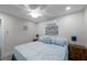 Cozy bedroom with ceiling fan, beach-themed decor, and a comfortable bed with nautical-themed accents at 2011 1St St, Indian Rocks Beach, FL 33785