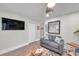 Relaxing living space with a flatscreen TV, coastal decor, and comfortable seating at 2011 1St St, Indian Rocks Beach, FL 33785