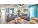 Bright living room with modern sofas, accent pillows, and a decorative coffee table at 2011 1St St, Indian Rocks Beach, FL 33785