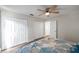 Spacious bedroom featuring a ceiling fan, and closet offering ample storage at 2011 1St St, Indian Rocks Beach, FL 33785