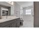 Accessible bathroom with modern fixtures, grab bars, and a roll-in shower, designed for comfort and safety at 2100 Mcmullen Rd, Largo, FL 33771