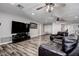 Large living area with luxury vinyl plank floors and ceiling fans at 2100 Mcmullen Rd, Largo, FL 33771